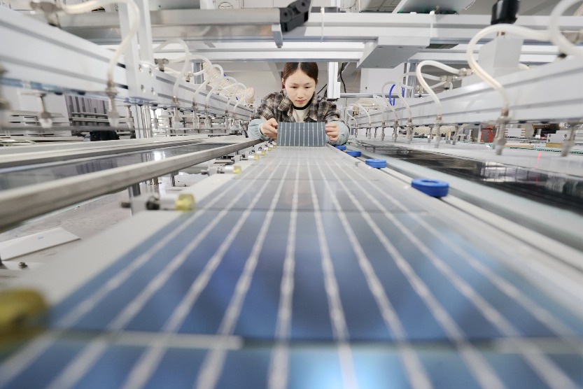 solar photovoltaic manufacture A worker is rushing to make solar photovoltaic modules for export.