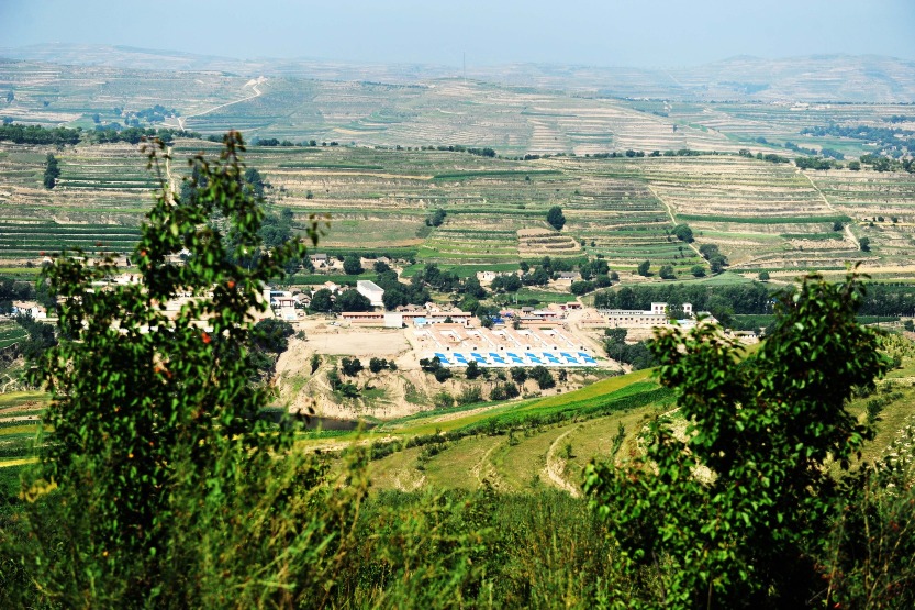 Aerial photo of Anding District, Dingxi, Gansu in 2015. From 2012 to 2015, more than 2.7 million people in Dingxi were lifted out of poverty.