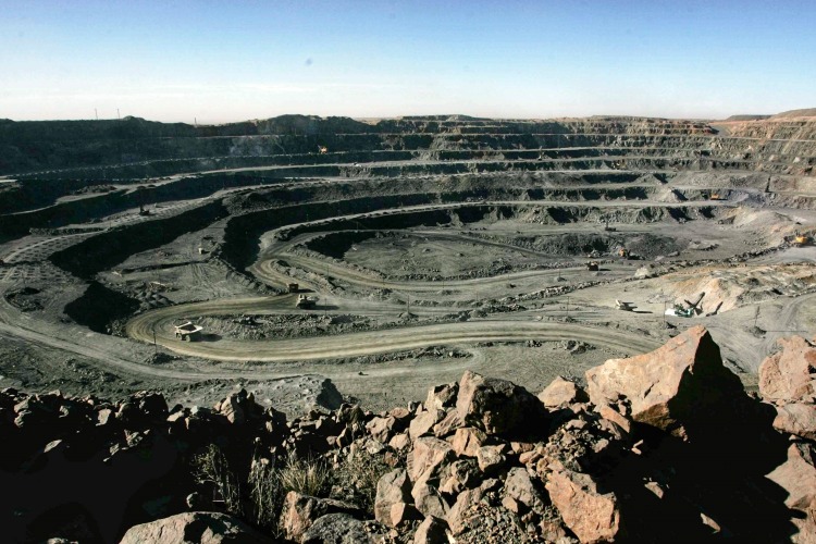The picture shows a rare earth mine in China.