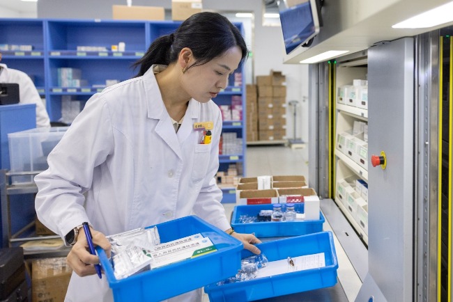 The authorities procure medicine and supplies centrally, and can use quantity to exchange for lower selling prices. Pictured is a pharmacy in a hospital in Huzhou, Zhejiang.