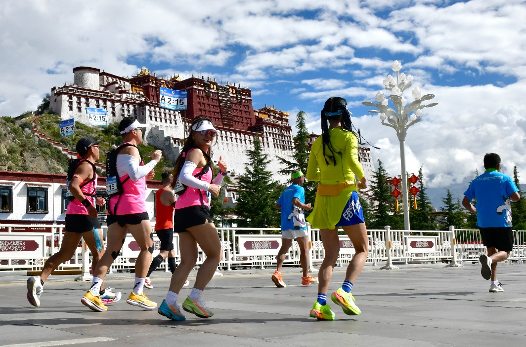 The Lhasa Marathon passes by the Potala Palace.